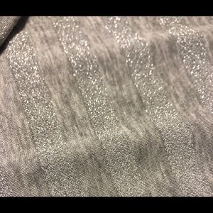 Sleeveless silver sparkly long dress.